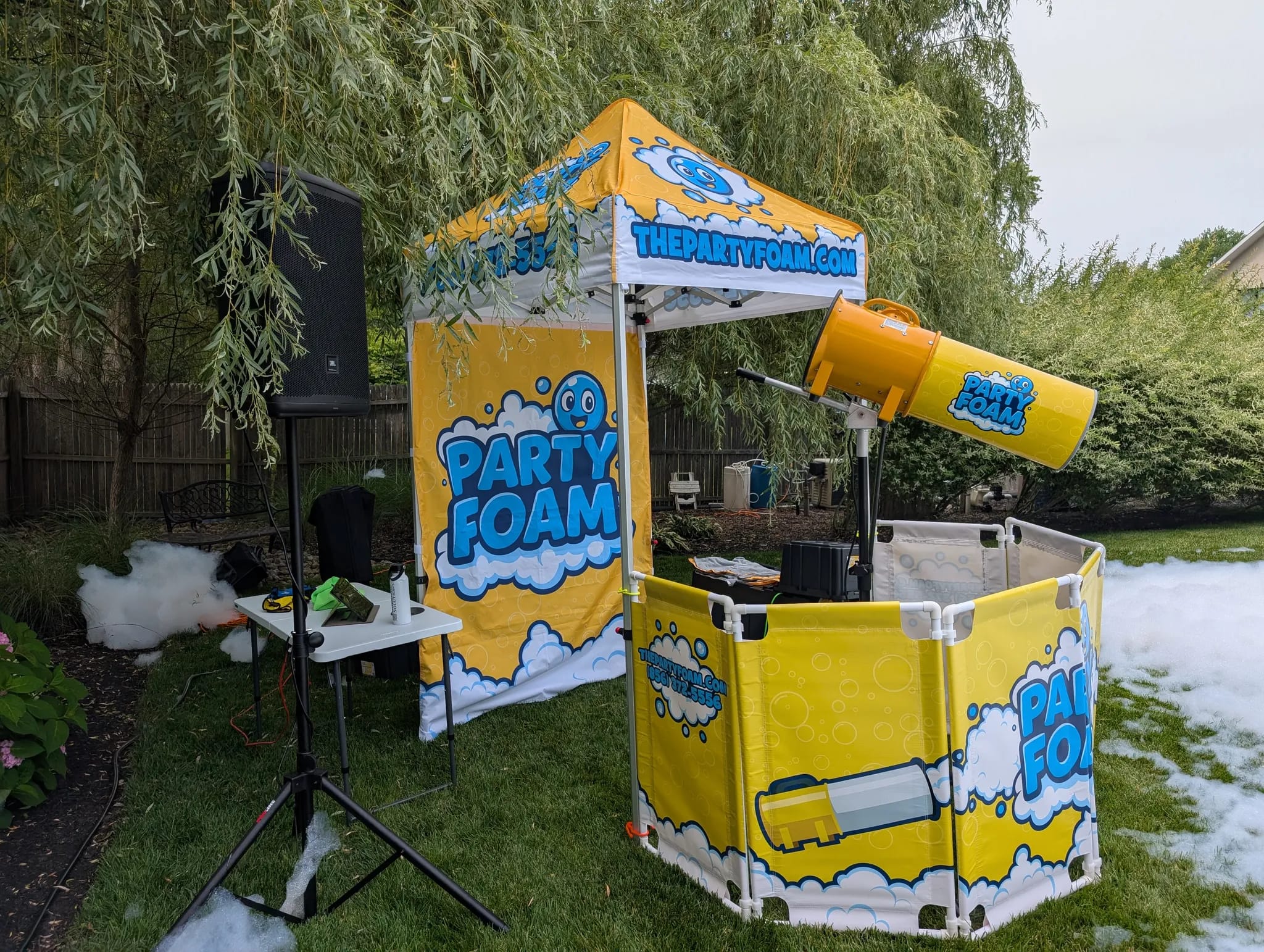backyard birthday party setup in a Burlington County NJ neighborhood with foam cannon