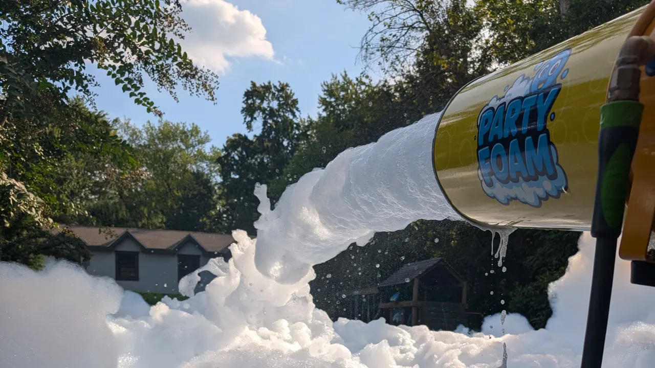 Party Foam cannon blasting foam into a backyard foam pit on a sunny day in South Jersey NJ