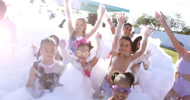 kids at an outdoor summer party in a Cherry Hill NJ backyard with foam